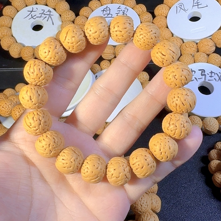 墨***许桃核吊坠16金丹桃核手串