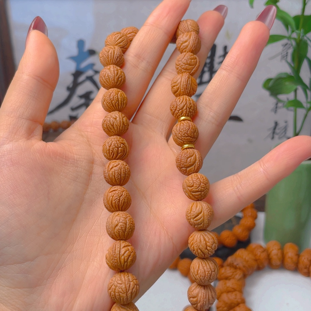 佳***腾秦岭龙纹桃核手持