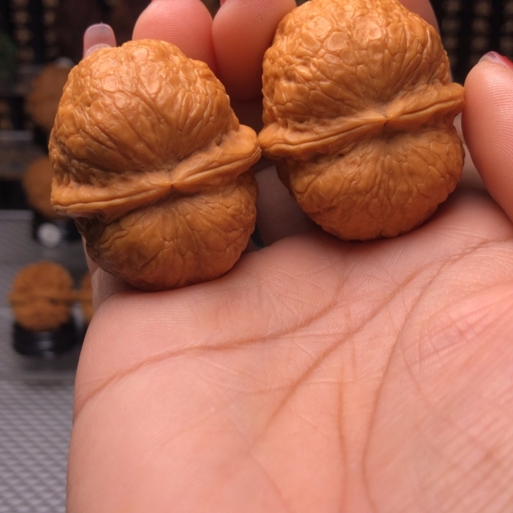 橄榄核把件峭壁元宝