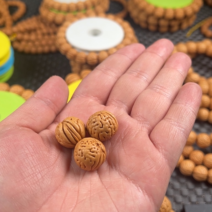 原***族手串桃核金丹散籽