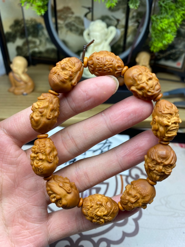 橄榄核雕工艺手串殷派罗汉