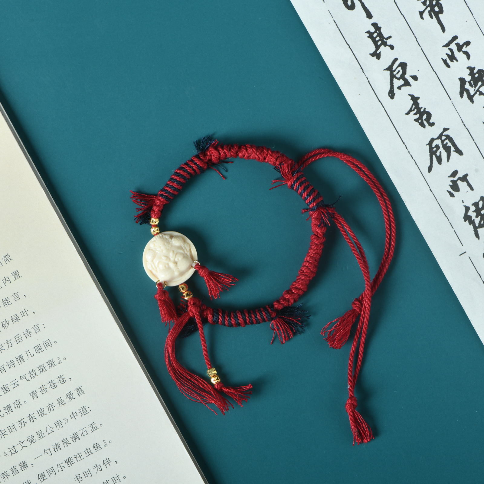 猛犸牙精雕黄财神手编红手绳手链