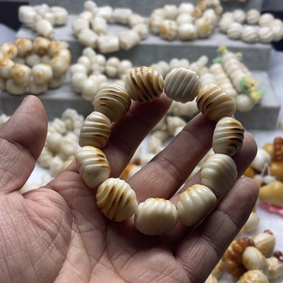 吊坠菩提根/象牙果全品花卷手串k20