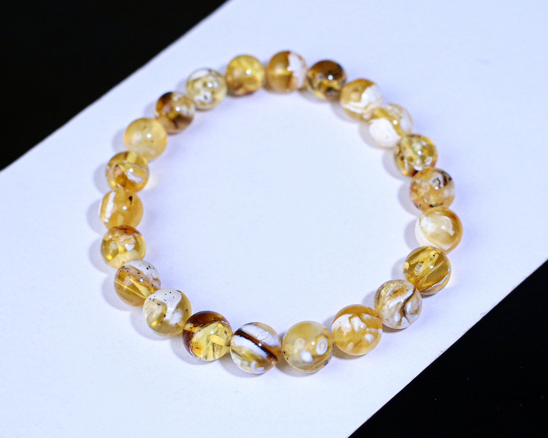 7.5克金瓷白拉丝沁色荧光圆珠手串蜜蜡