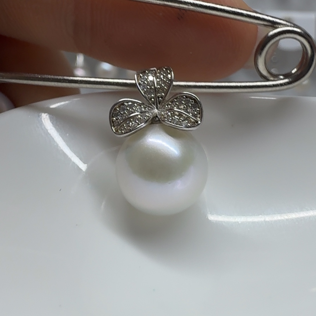 柠****银S925镶嵌淡水珍珠耳饰珍珠