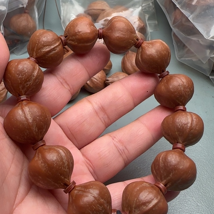 蕭***張橄榄核手串橄榄核原皮铁核