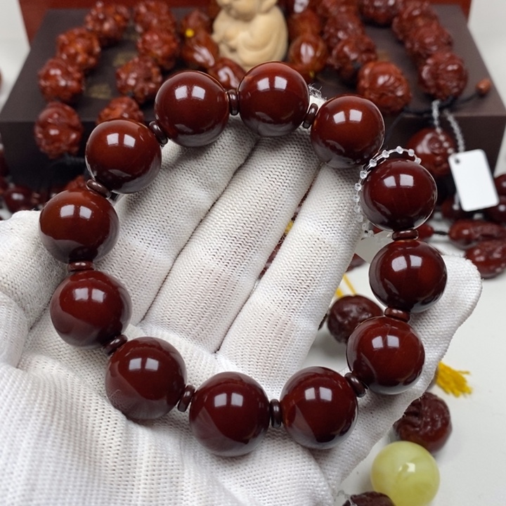 橄榄核吊坠扎***文87765544