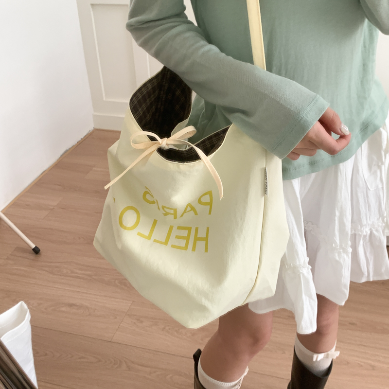 301双面可背懒惰松弛感包包女大容量新款休闲字母学生上课通勤包