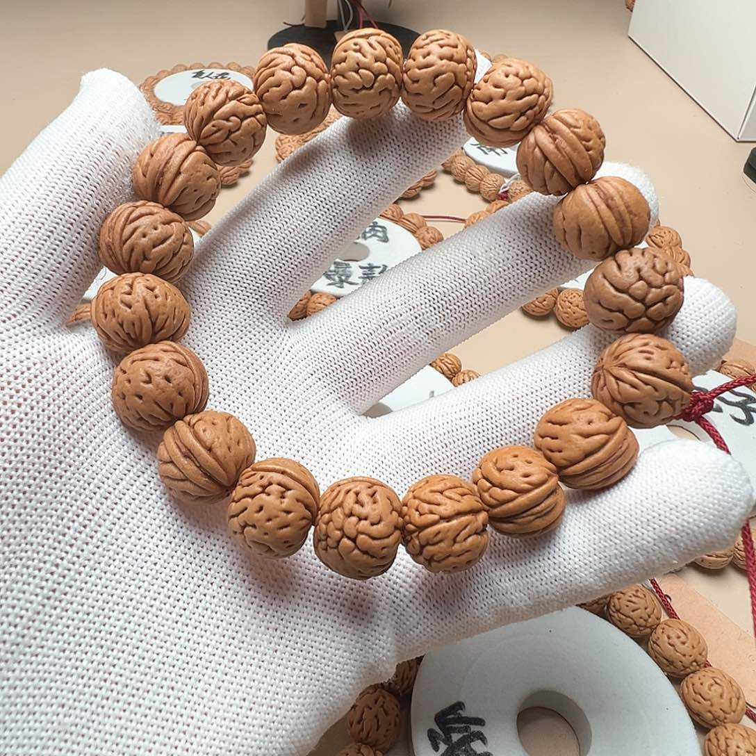 璞***桃核手串猛子爱心