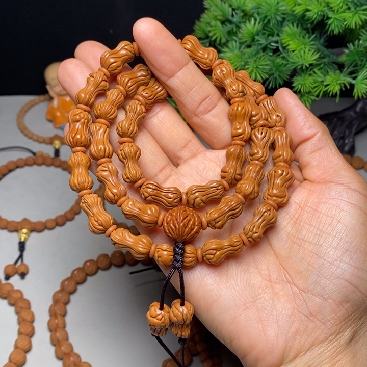 江***早手串桃核花生脖挂