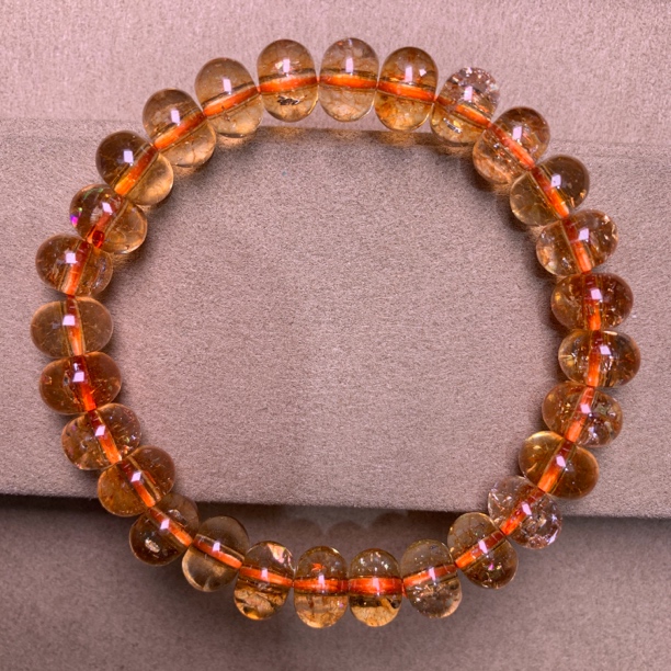 A 225  卡10mm金太阳算盘珠手串