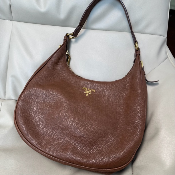 95新 Prada/普拉达 棕金元宝全皮单肩包063484