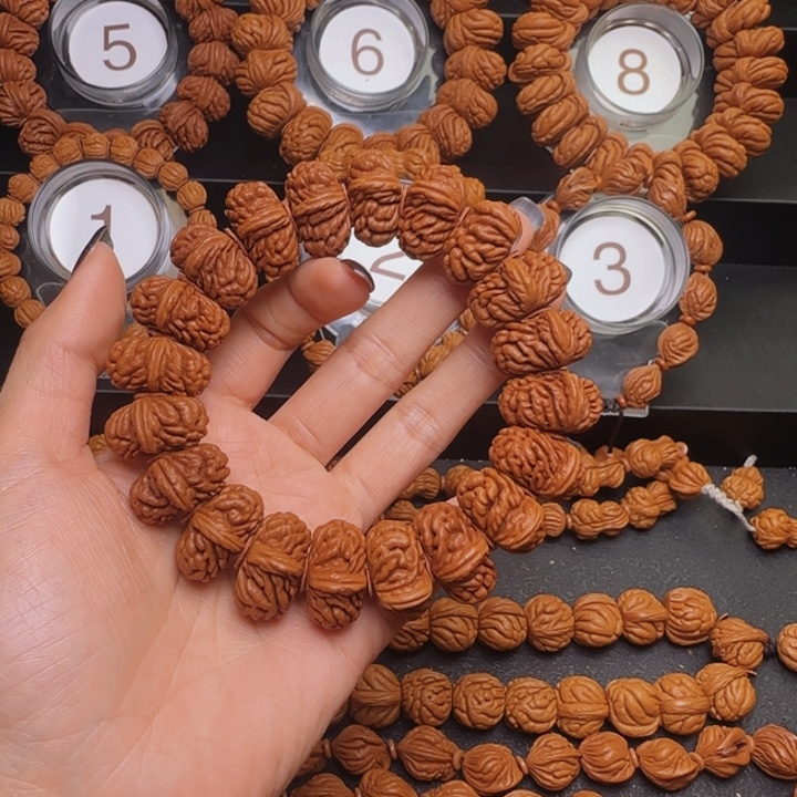 我***强手串桃核刺龙手串