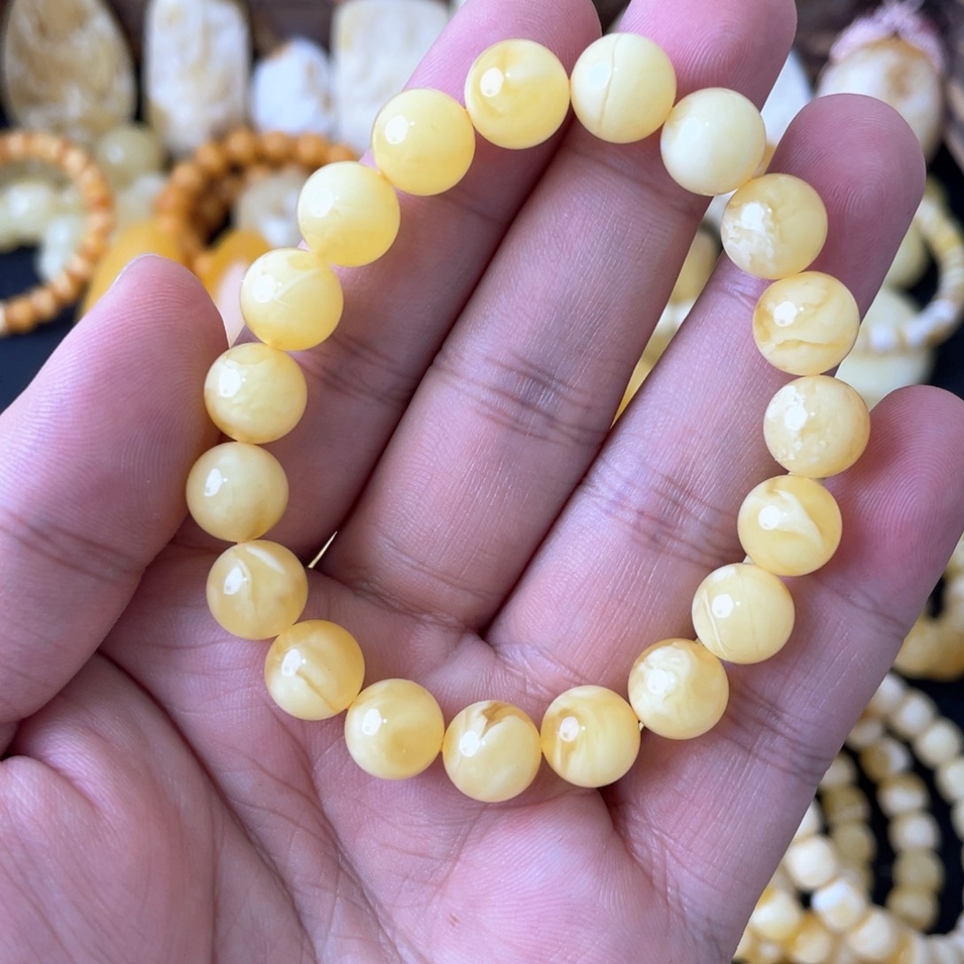 琥珀手串未镶嵌9.9俄料妖白花圆珠手串