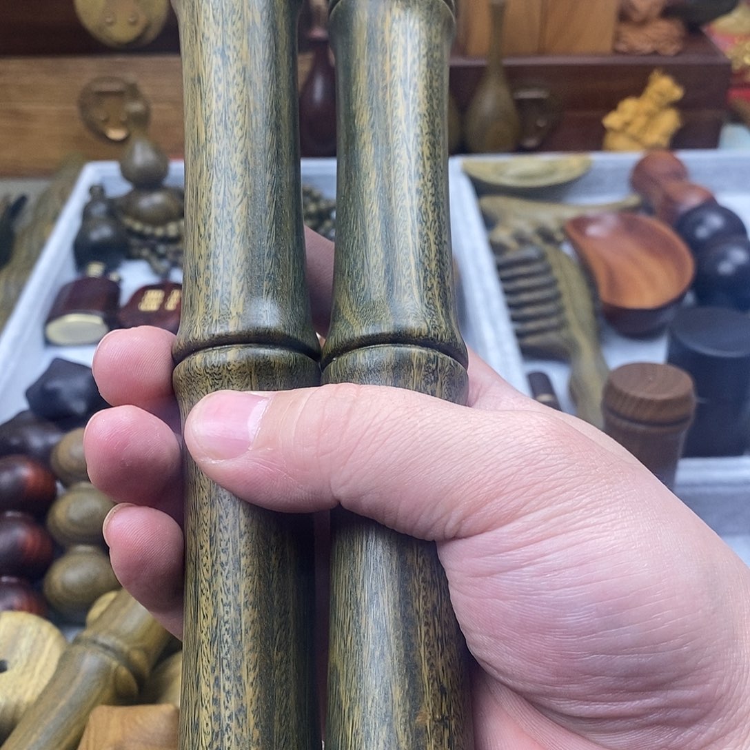 梁***N香榧木阿根廷绿檀手把件