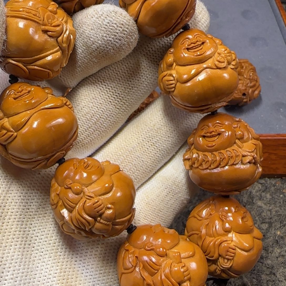 橄榄核吊坠佟*……………………