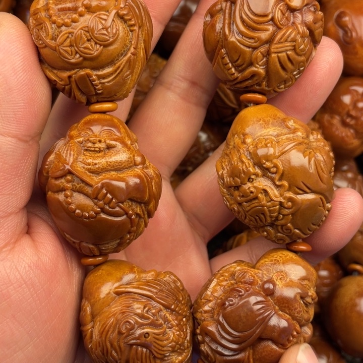 橄榄核吊坠难****)橄榄核手持