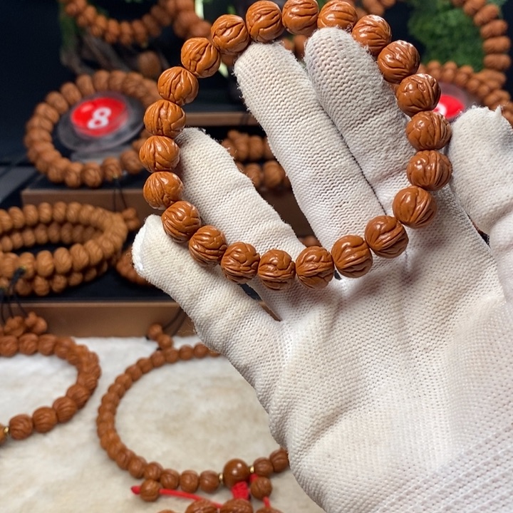 桃核吊坠达***琪秦岭龙纹