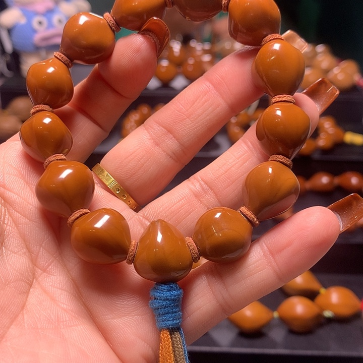 刘***忧手串/手链橄榄核三花手串