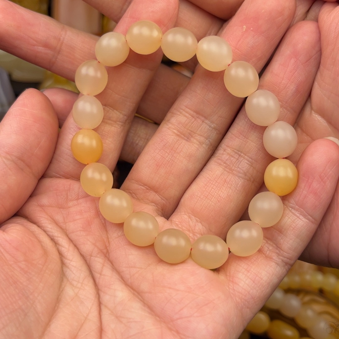 姜***叔石英质玉未镶嵌黄蜡石手串