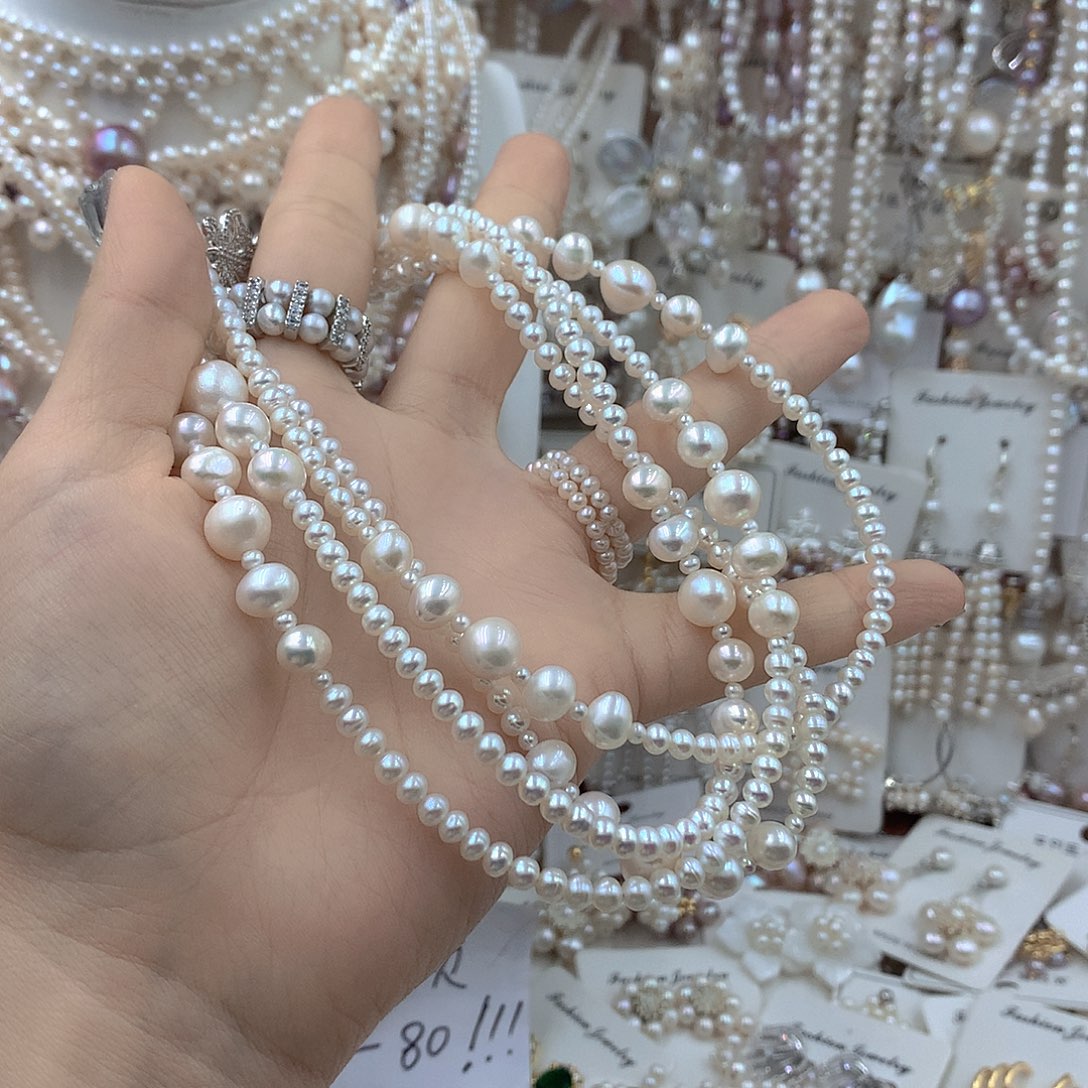 沅***芷银S925镶嵌淡水珍珠耳饰