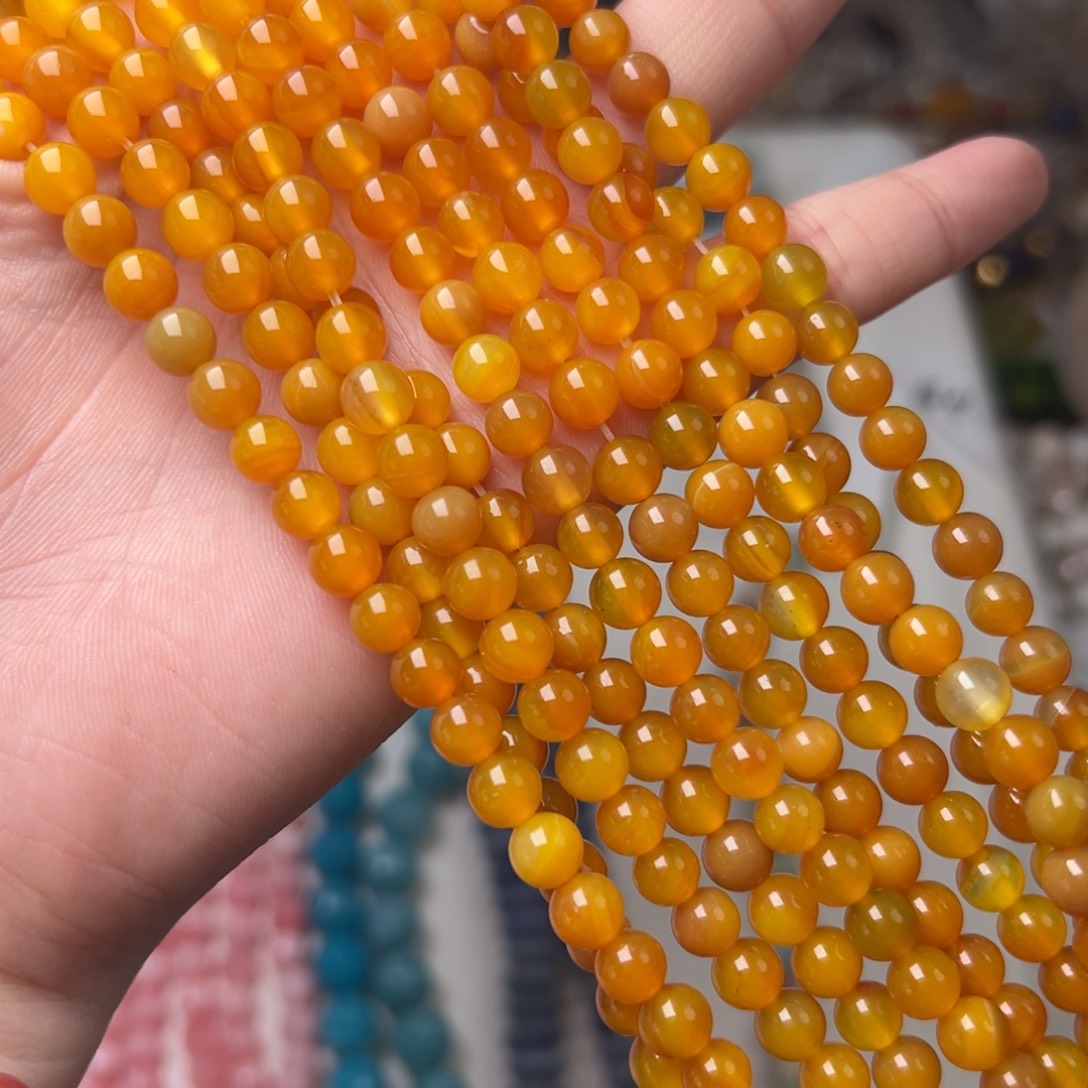 玛瑙/玉髓合金珠宝半成品V46。6.3mm天然飘花黄玛瑙圆珠一条