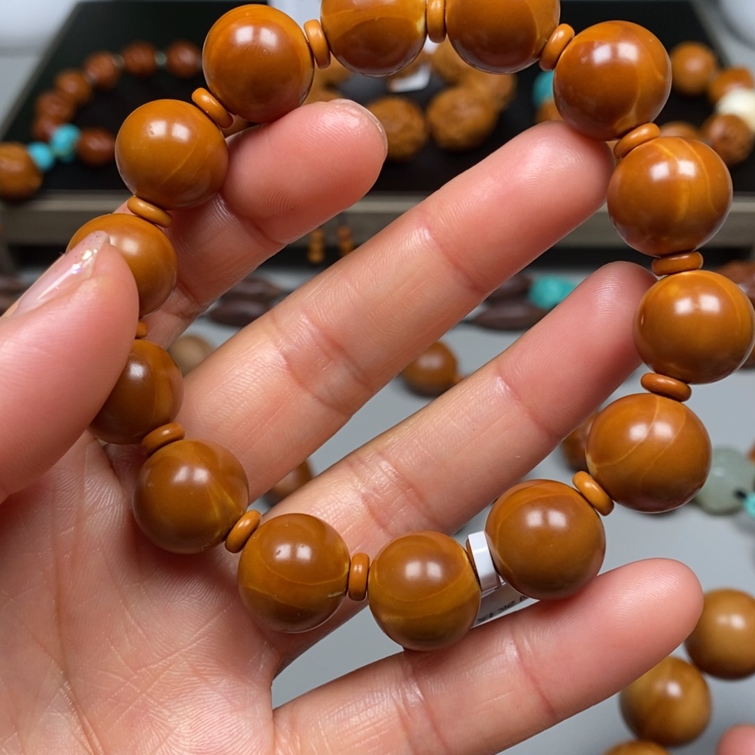 橄榄核吊坠正圆手串