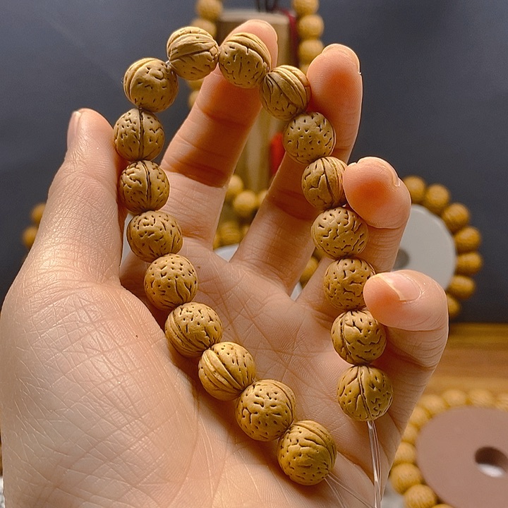 来**拒桃核手串桃核手串