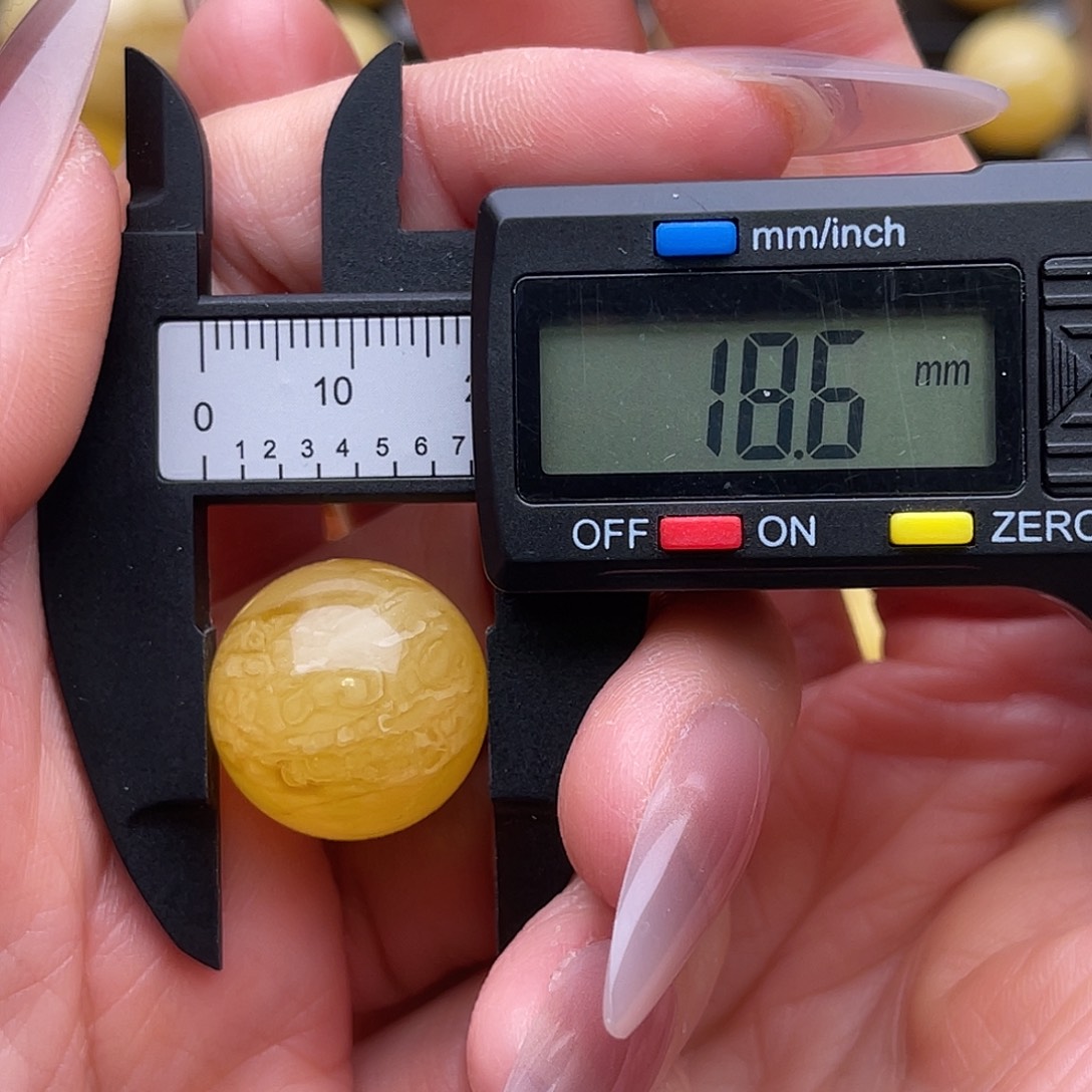 俗***人琥珀未镶嵌裸石蜜蜡虎皮纹圆珠鸽