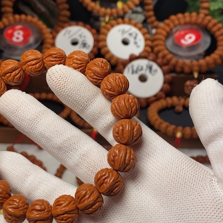 桃核手串昆****司秦岭龙纹