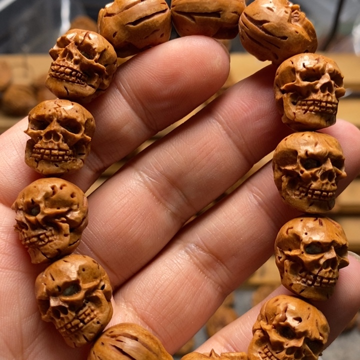 桃核手工雕刻骷髅手串