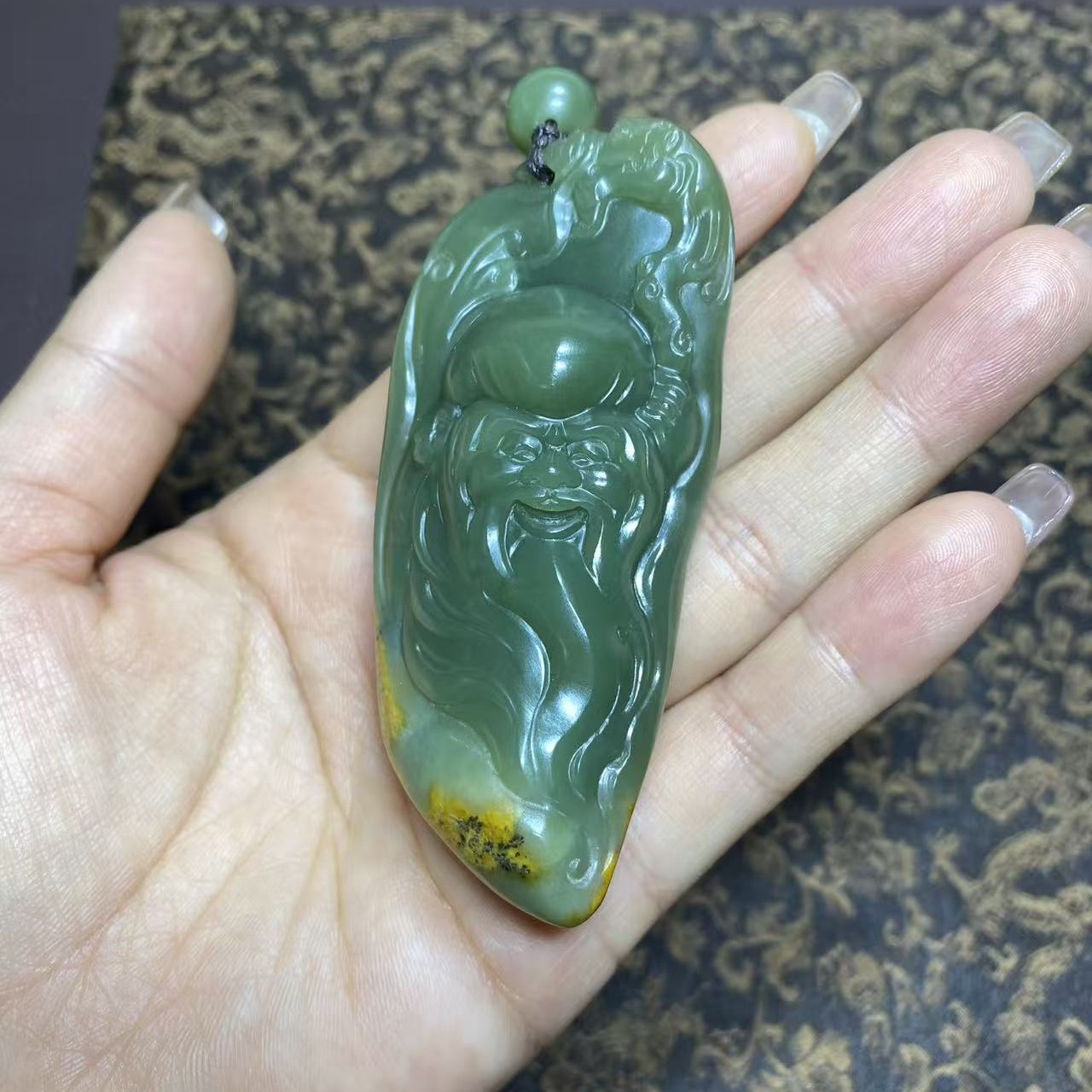 析木河磨玉带皮寿星手把件