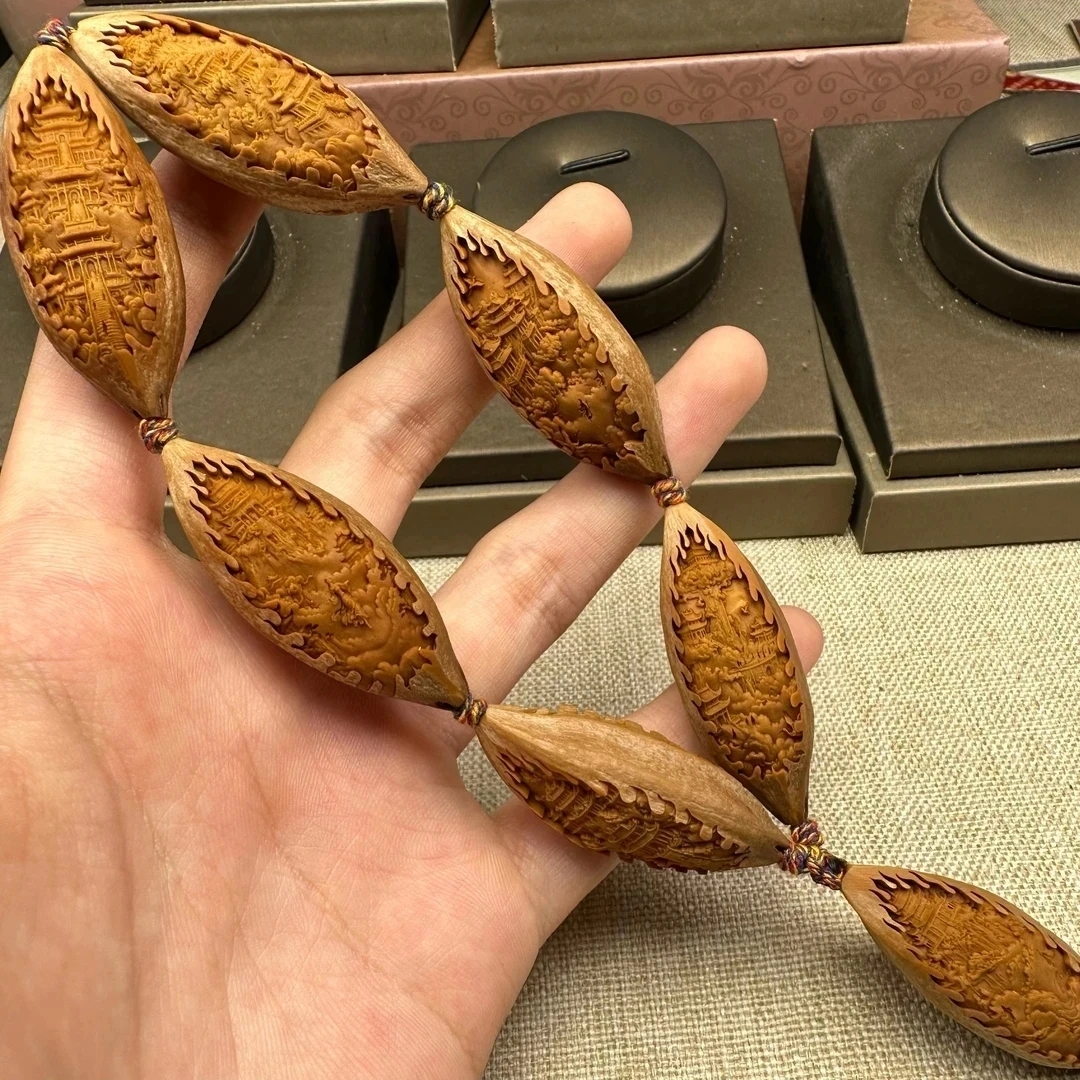 瑾亜，原皮风景观音橄榄核雕手串