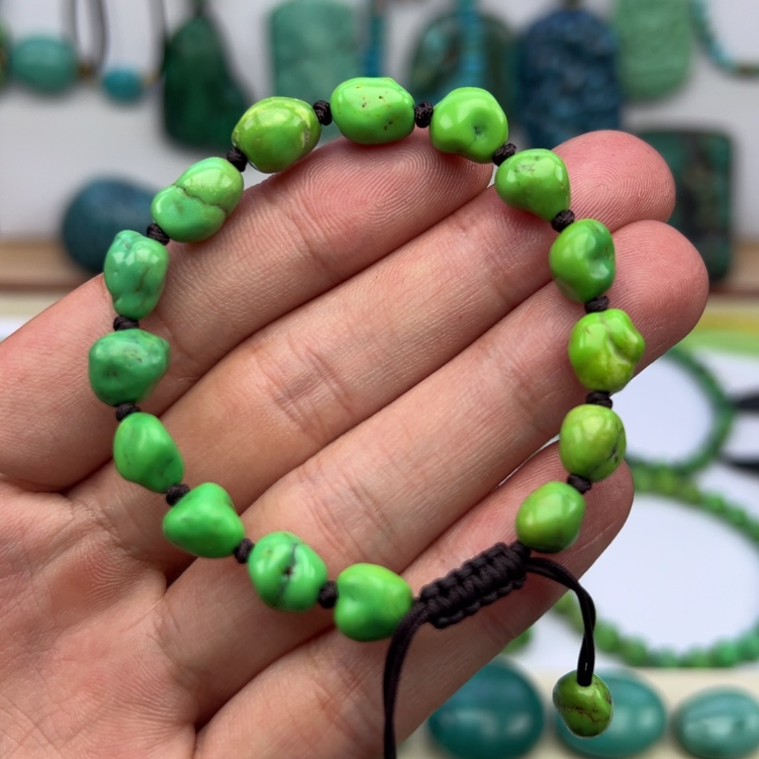 捷***建菜籽绿水草纹随型手串