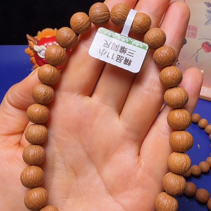 阿***朱猴头核桃吊坠凤羽