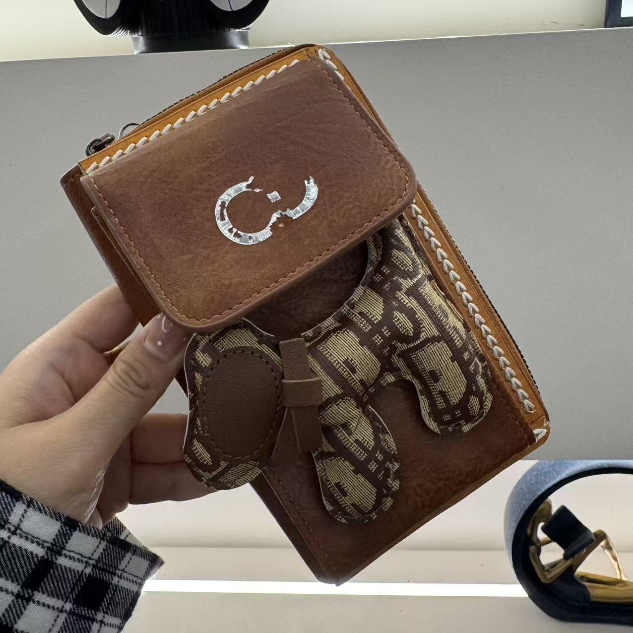 太阳花时尚斜挎手机包包-38474