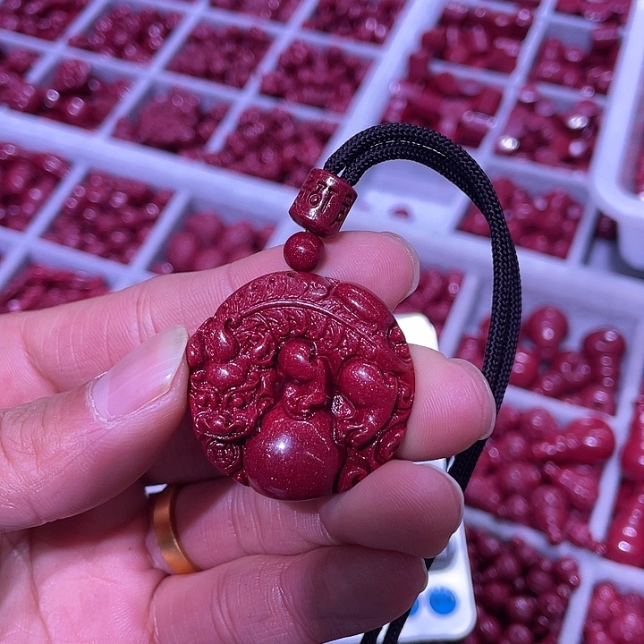 天然辰砂紫金砂薄的貔貅抱球