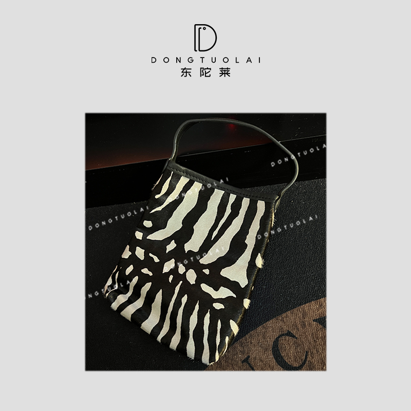 《白龙马》包包皮质时尚百搭休闲女士黑白色马毛牛皮单肩肩包设计师