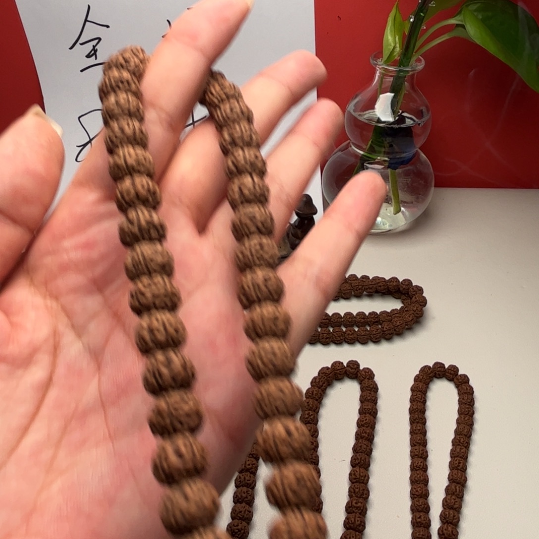 黑***衣手串柏香籽/百香籽