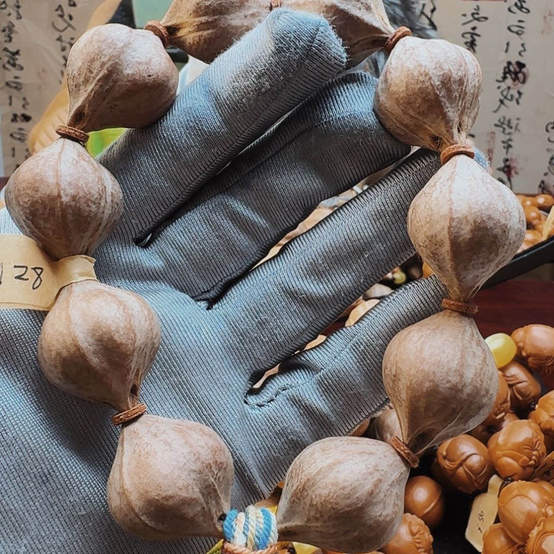 郝***叔橄榄核手串三面佛蜜桃臀