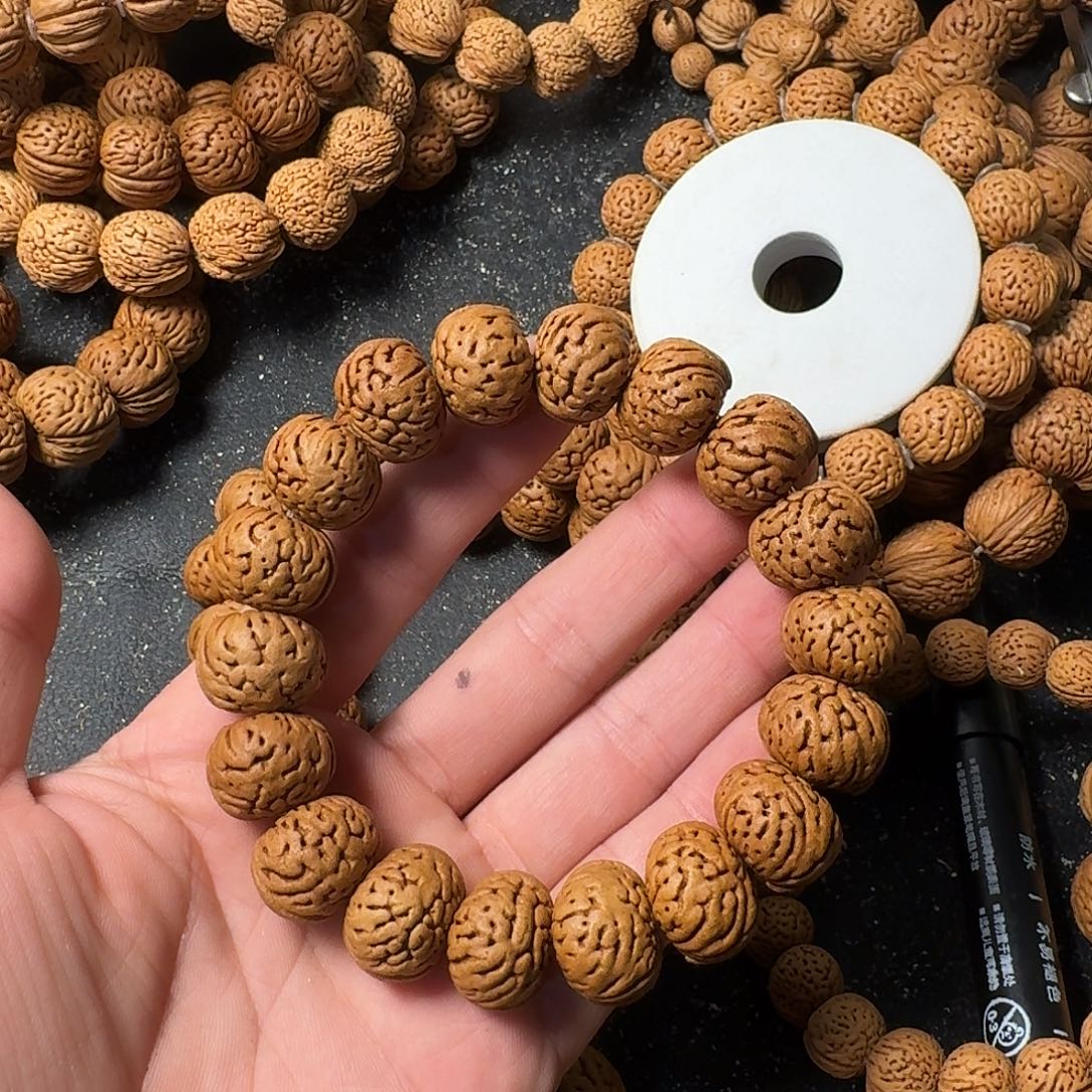 浇***～吊坠桃核纽扣手串