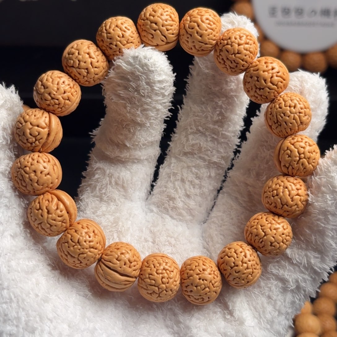 人***途桃核吊坠16左右盘锦野生密纹金豆