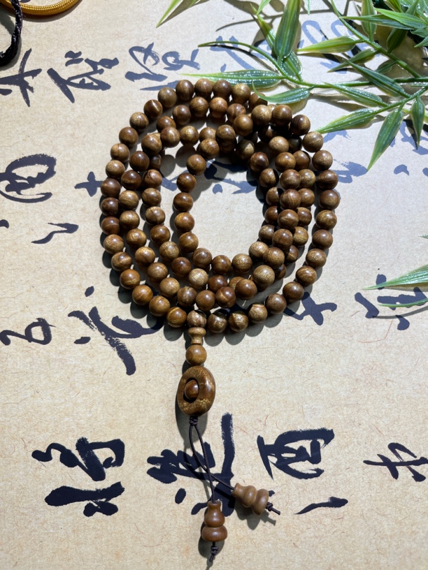 B002小叶金丝楠枯木水波纹0.8×108颗多圈手链