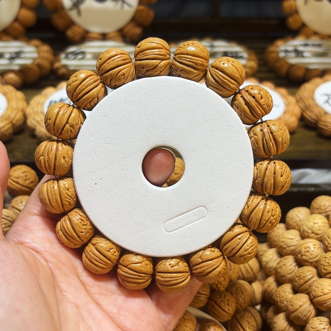 ?****?16➕肉纹元宝桃核手串