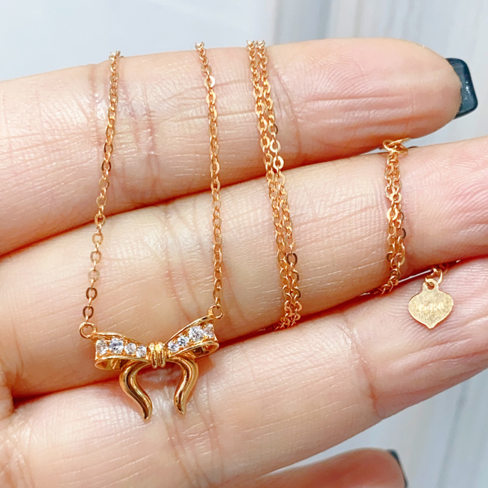 合成锆石18K精致蝴蝶结套链2.57克