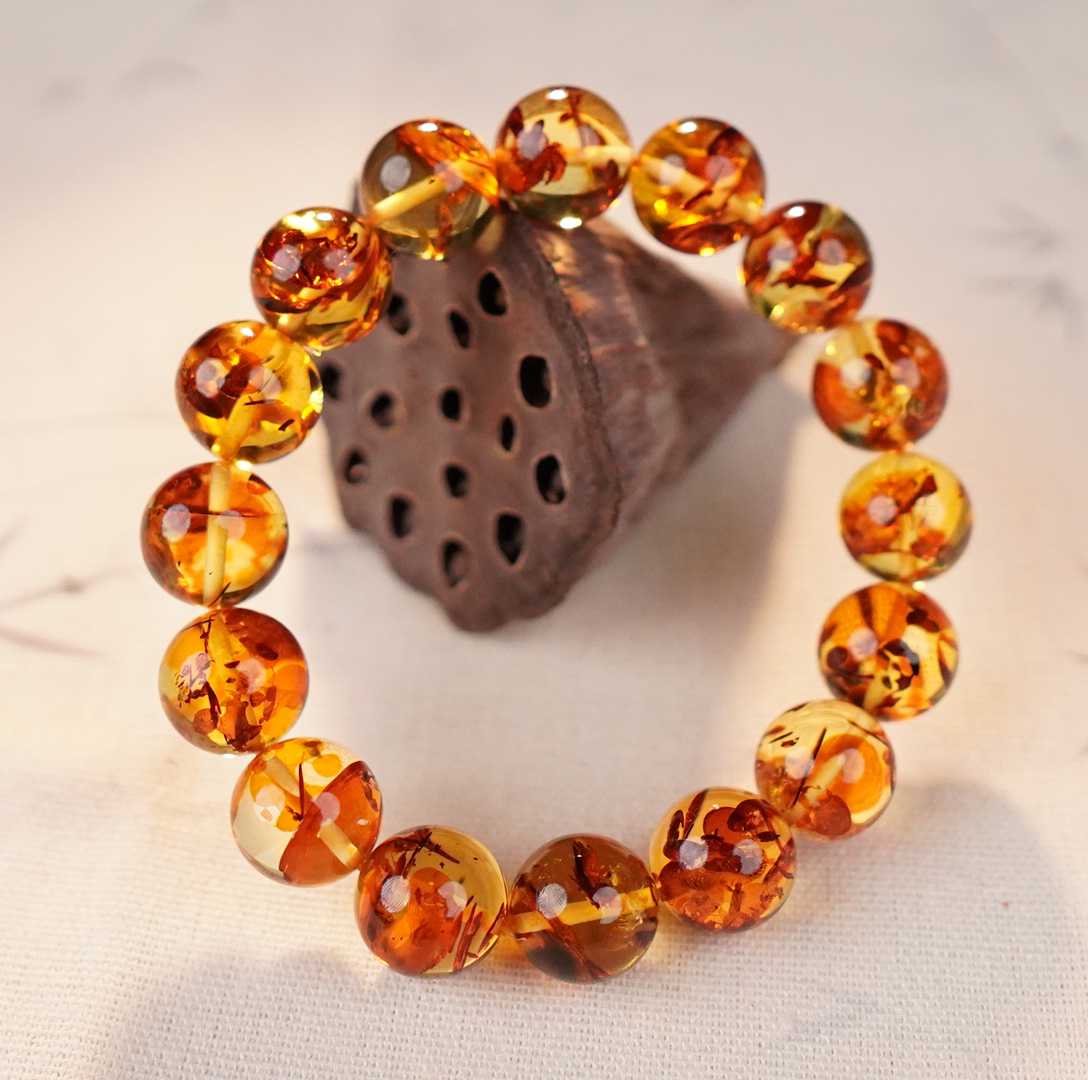 【亿景珠宝】12+圆珠俄料天然花珀手串单圈时尚多样性发货SSY34C078