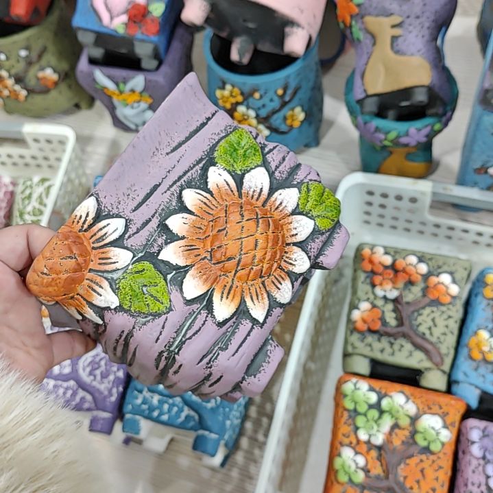 红陶吸水透气的白陶花盆