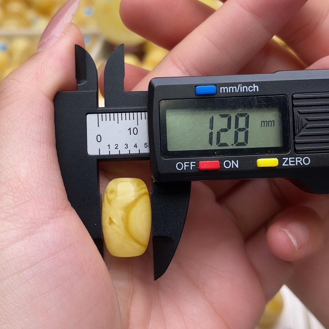 苏***周琥珀未镶嵌裸石蜜蜡桶珠梦