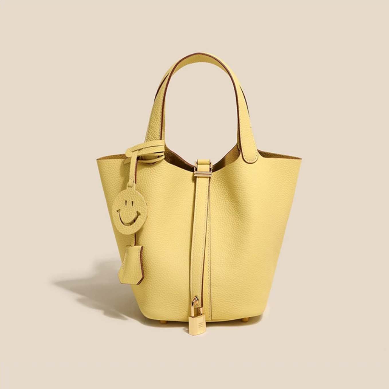 菜蓝子TC100%头层真牛皮手提锁扣都市简约风女包手拎包轻奢水桶包