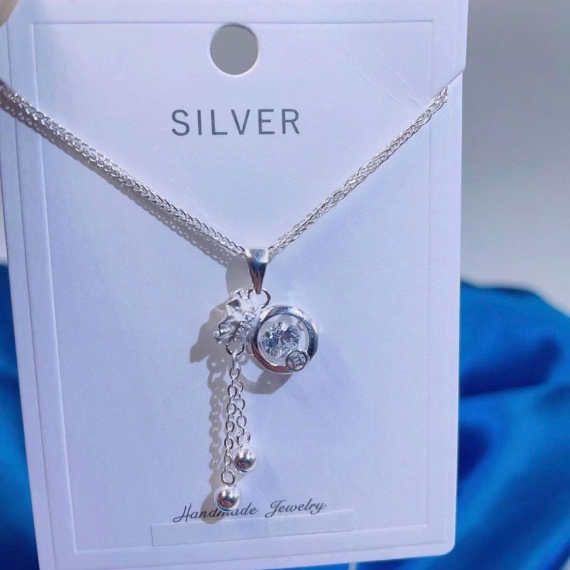 坠链均足银锆石 足银灵动福袋流苏项链